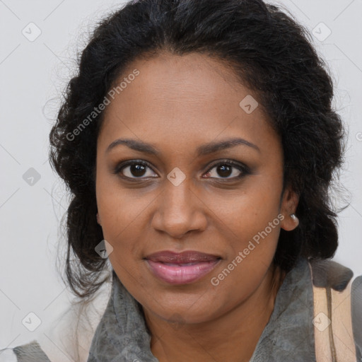 Joyful black young-adult female with long  brown hair and brown eyes