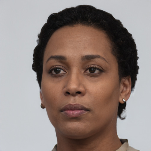 Neutral latino young-adult female with short  black hair and brown eyes