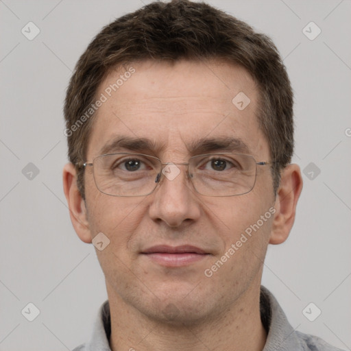 Joyful white adult male with short  brown hair and grey eyes