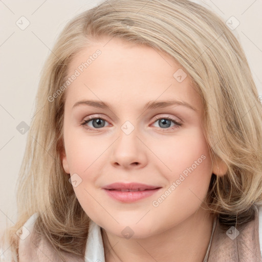 Joyful white young-adult female with long  brown hair and blue eyes