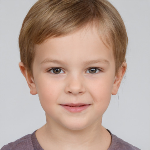 Joyful white child male with short  brown hair and brown eyes