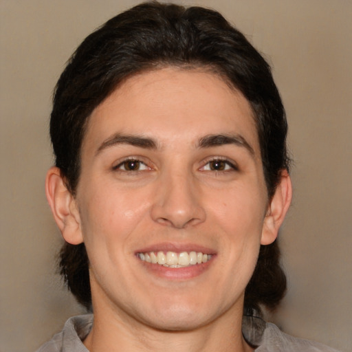 Joyful white young-adult male with medium  brown hair and brown eyes