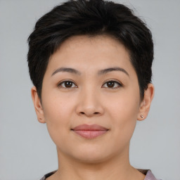 Joyful asian young-adult female with short  brown hair and brown eyes