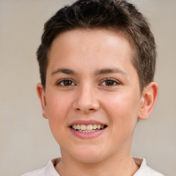 Joyful white child male with short  brown hair and brown eyes