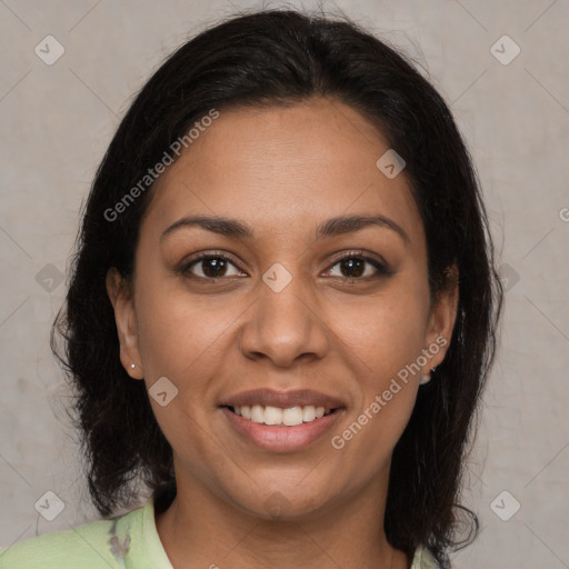 Joyful latino young-adult female with medium  brown hair and brown eyes