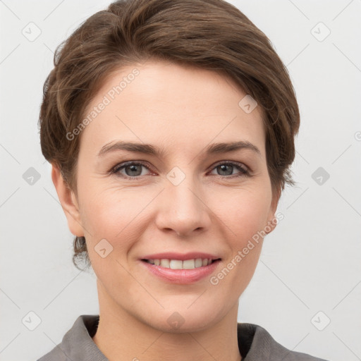 Joyful white young-adult female with short  brown hair and grey eyes