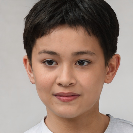Joyful white child female with short  brown hair and brown eyes