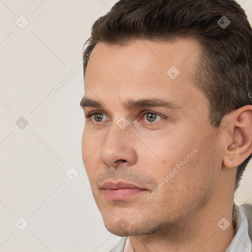 Neutral white young-adult male with short  brown hair and brown eyes