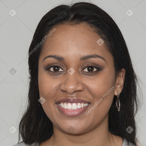 Joyful black young-adult female with medium  brown hair and brown eyes