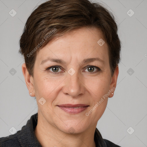 Joyful white adult female with short  brown hair and grey eyes