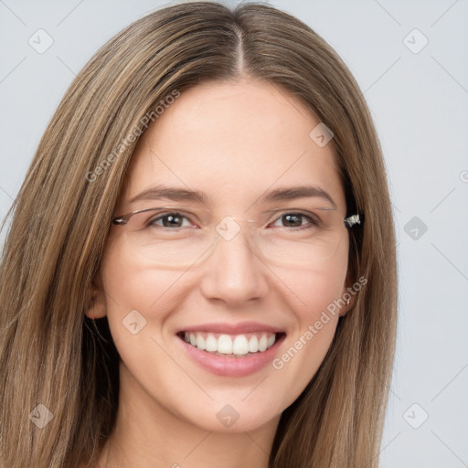 Joyful white young-adult female with long  brown hair and brown eyes