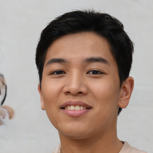 Joyful asian young-adult female with short  black hair and brown eyes