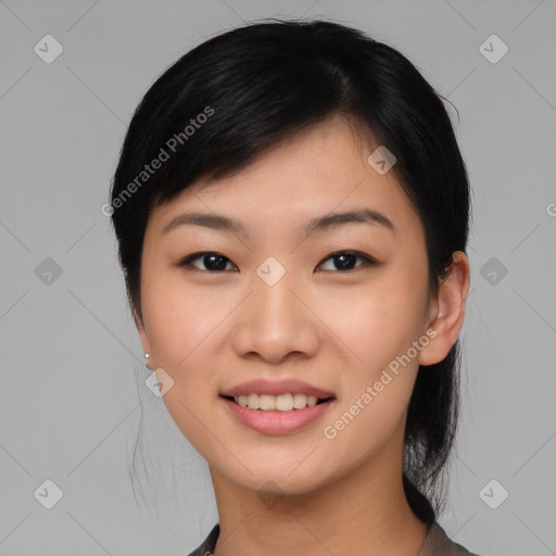 Joyful asian young-adult female with medium  black hair and brown eyes