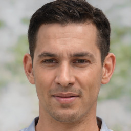 Joyful white adult male with short  brown hair and brown eyes