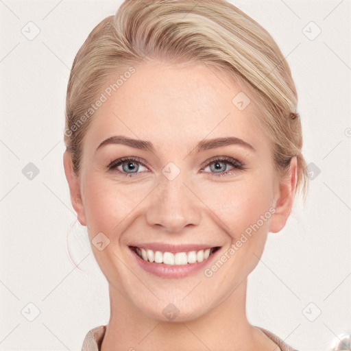 Joyful white young-adult female with medium  brown hair and blue eyes