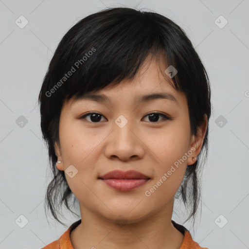 Joyful asian young-adult female with medium  black hair and brown eyes