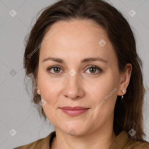 Joyful white adult female with medium  brown hair and brown eyes