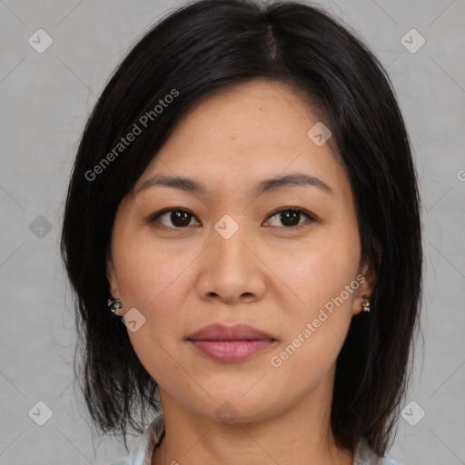 Joyful latino young-adult female with medium  brown hair and brown eyes