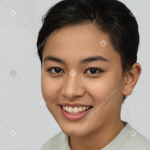 Joyful asian young-adult female with short  brown hair and brown eyes