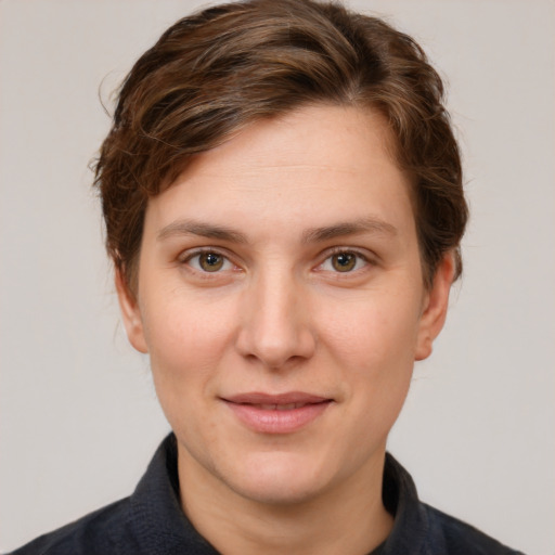 Joyful white young-adult female with short  brown hair and grey eyes