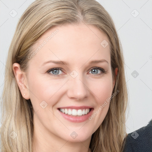 Joyful white young-adult female with long  brown hair and blue eyes