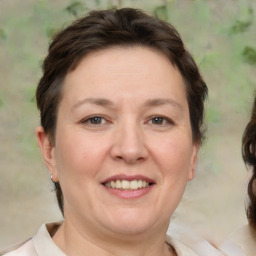 Joyful white adult female with short  brown hair and brown eyes