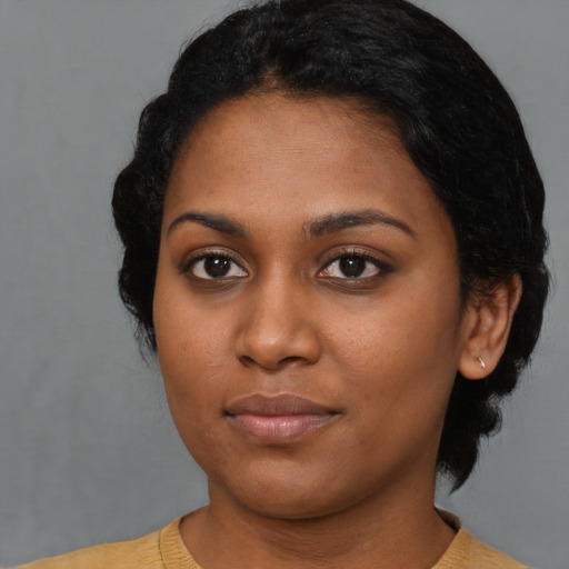 Neutral black young-adult female with short  black hair and brown eyes