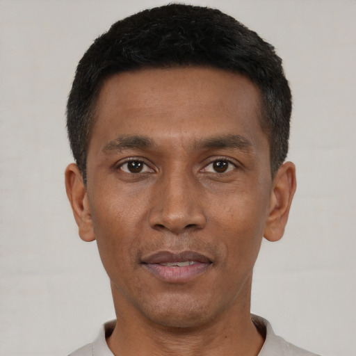 Neutral black young-adult male with short  black hair and brown eyes