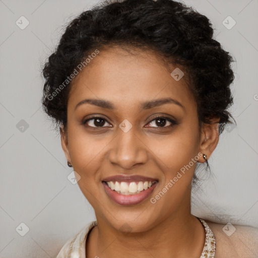 Joyful black young-adult female with long  black hair and brown eyes