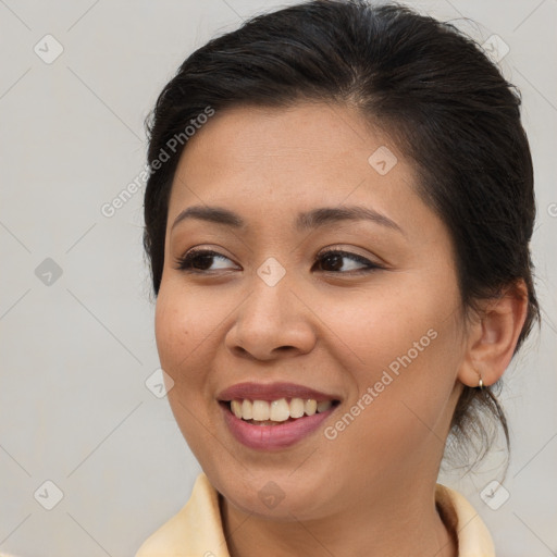 Joyful asian young-adult female with medium  brown hair and brown eyes