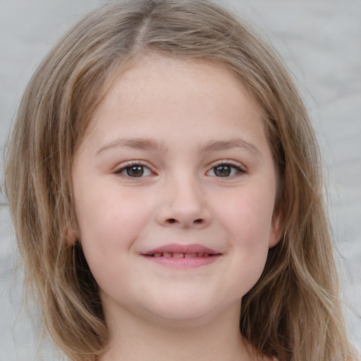 Joyful white child female with medium  brown hair and blue eyes