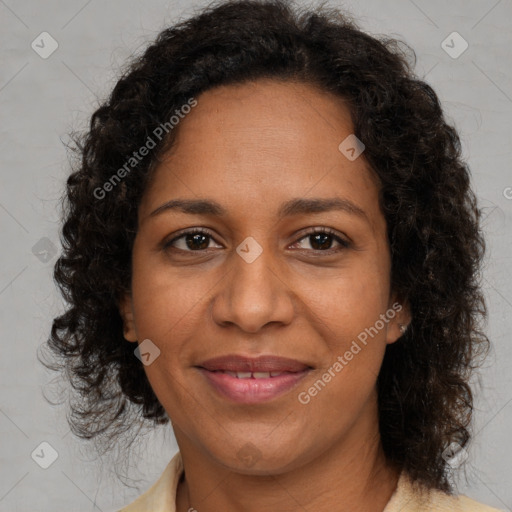 Joyful black adult female with medium  brown hair and brown eyes