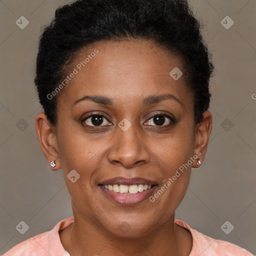 Joyful black young-adult female with short  brown hair and brown eyes