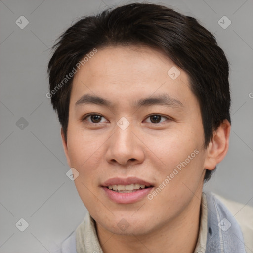 Joyful asian young-adult male with short  brown hair and brown eyes