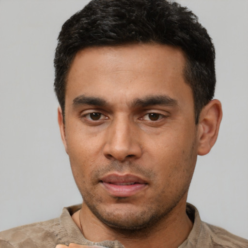 Neutral latino young-adult male with short  black hair and brown eyes