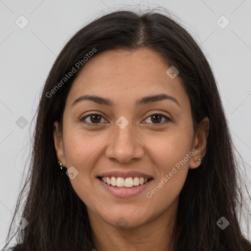 Joyful latino young-adult female with long  brown hair and brown eyes