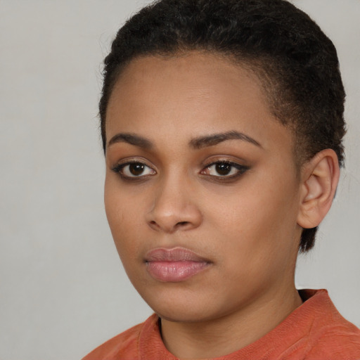 Neutral black young-adult female with short  brown hair and brown eyes