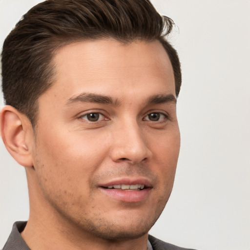 Joyful white young-adult male with short  brown hair and brown eyes