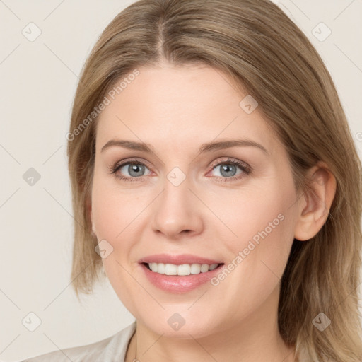 Joyful white young-adult female with medium  brown hair and blue eyes