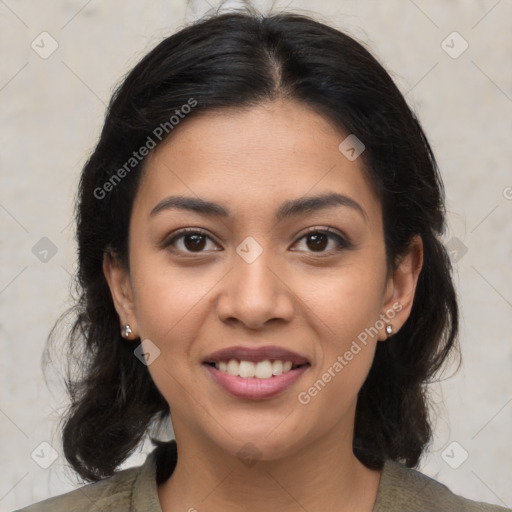 Joyful latino young-adult female with medium  brown hair and brown eyes