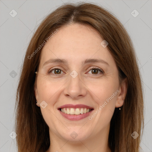 Joyful white adult female with long  brown hair and brown eyes