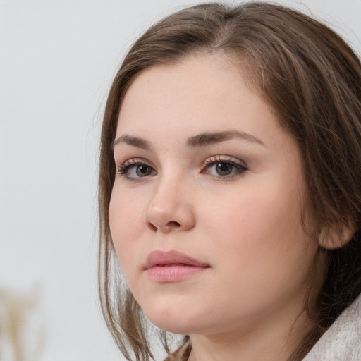 Neutral white young-adult female with medium  brown hair and grey eyes