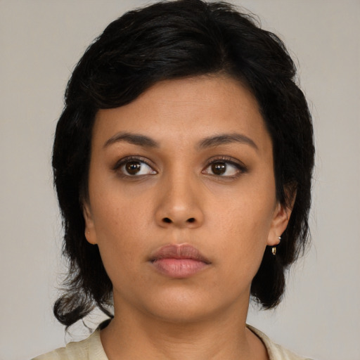 Neutral latino young-adult female with medium  black hair and brown eyes