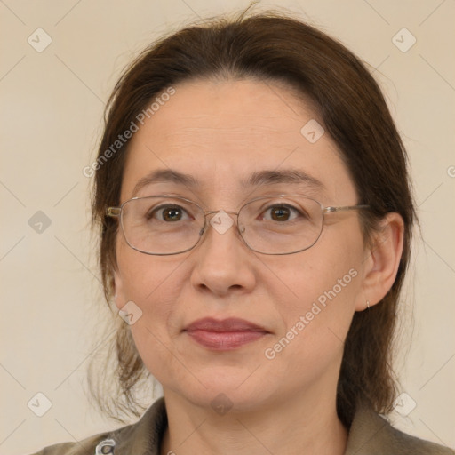 Joyful white adult female with medium  brown hair and brown eyes