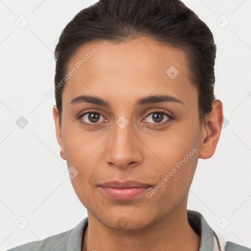 Joyful latino young-adult female with short  brown hair and brown eyes