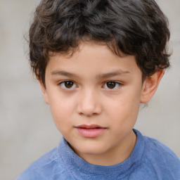 Joyful white child male with short  brown hair and brown eyes