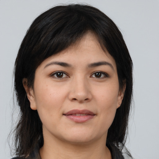 Joyful asian young-adult female with medium  brown hair and brown eyes