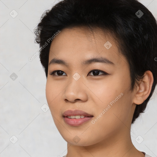 Joyful asian young-adult female with short  black hair and brown eyes