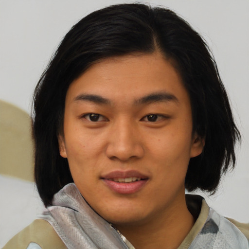 Joyful asian young-adult female with medium  black hair and brown eyes