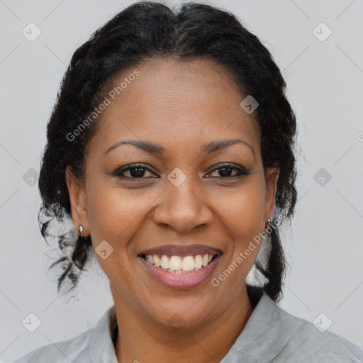 Joyful black adult female with short  brown hair and brown eyes